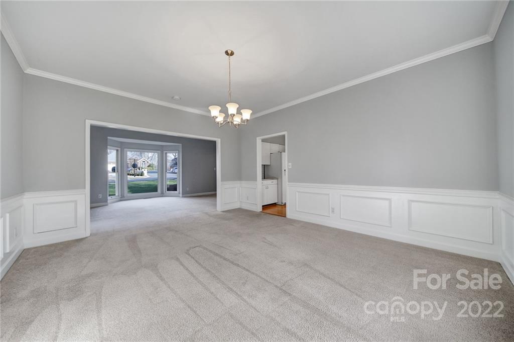 584 Cranborne Chase Fort Mill, SC 29708 - Photo 13 of 36 a view of a livingroom with furniture and chandelier