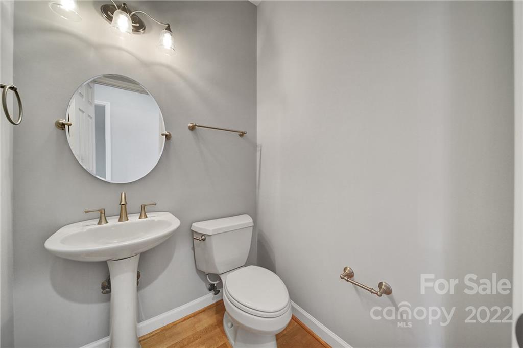 584 Cranborne Chase Fort Mill, SC 29708 - Photo 15 of 36 a bathroom with a toilet sink and mirror