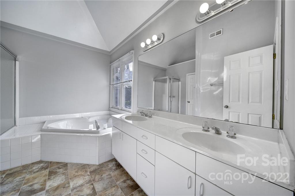 584 Cranborne Chase Fort Mill, SC 29708 - Photo 19 of 36 a bathroom with a double vanity sink mirror and bathtub