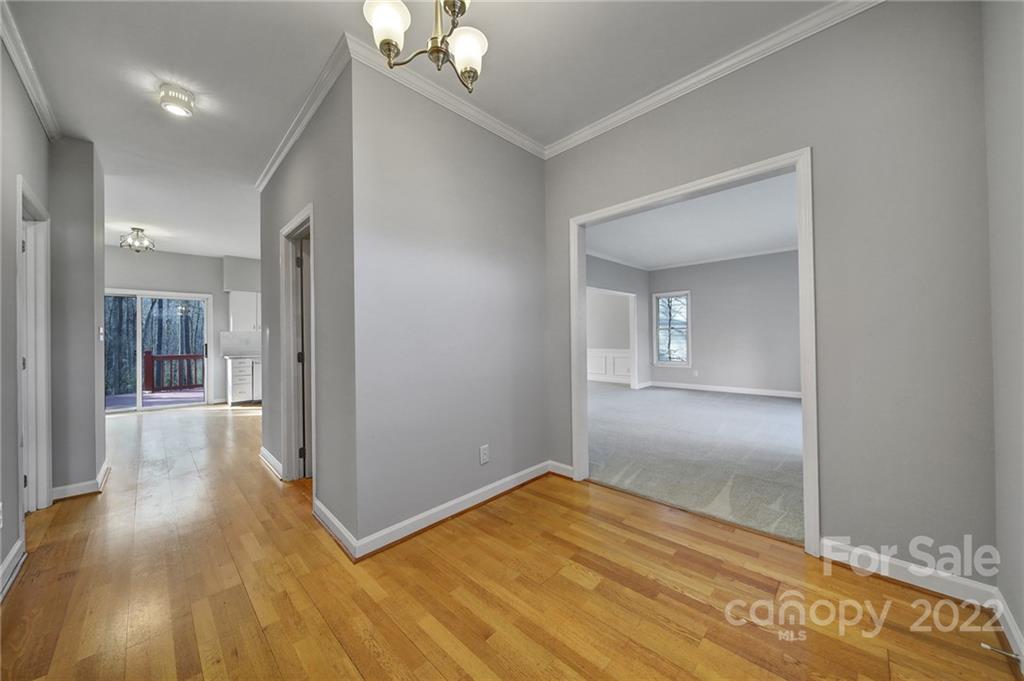 584 Cranborne Chase Fort Mill, SC 29708 - Photo 2 of 36 a view of a hallway with wooden floor and a bathroom