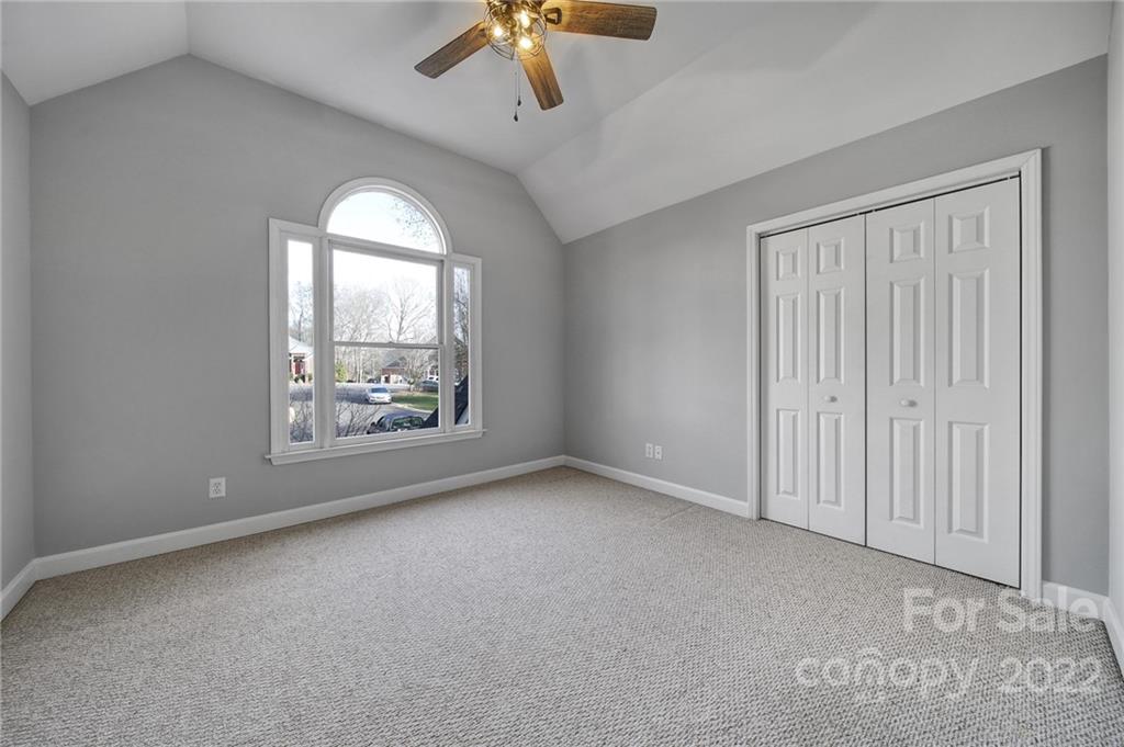 584 Cranborne Chase Fort Mill, SC 29708 - Photo 23 of 36 an empty room with windows and ceiling fan