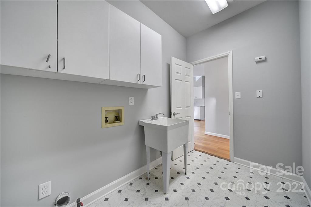 584 Cranborne Chase Fort Mill, SC 29708 - Photo 26 of 36 a kitchen with granite countertop a sink and white cabinets