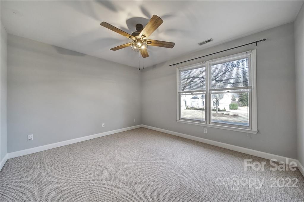 584 Cranborne Chase Fort Mill, SC 29708 - Photo 27 of 36 an empty room with windows and fan