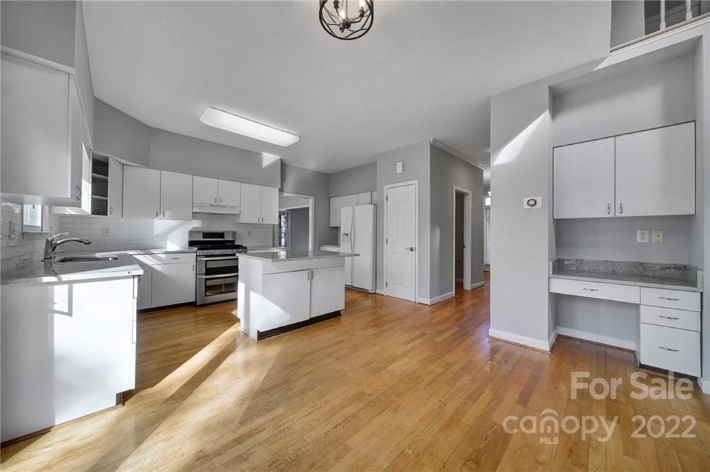 584 Cranborne Chase Fort Mill, SC 29708 - Photo 3 of 36 a kitchen with stainless steel appliances a refrigerator sink and stove
