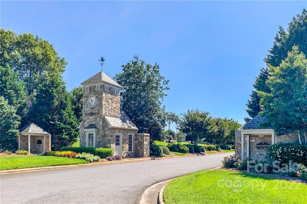584 Cranborne Chase Fort Mill, SC 29708 - Photo 34 of 36 a front view of a house with a garden and yard