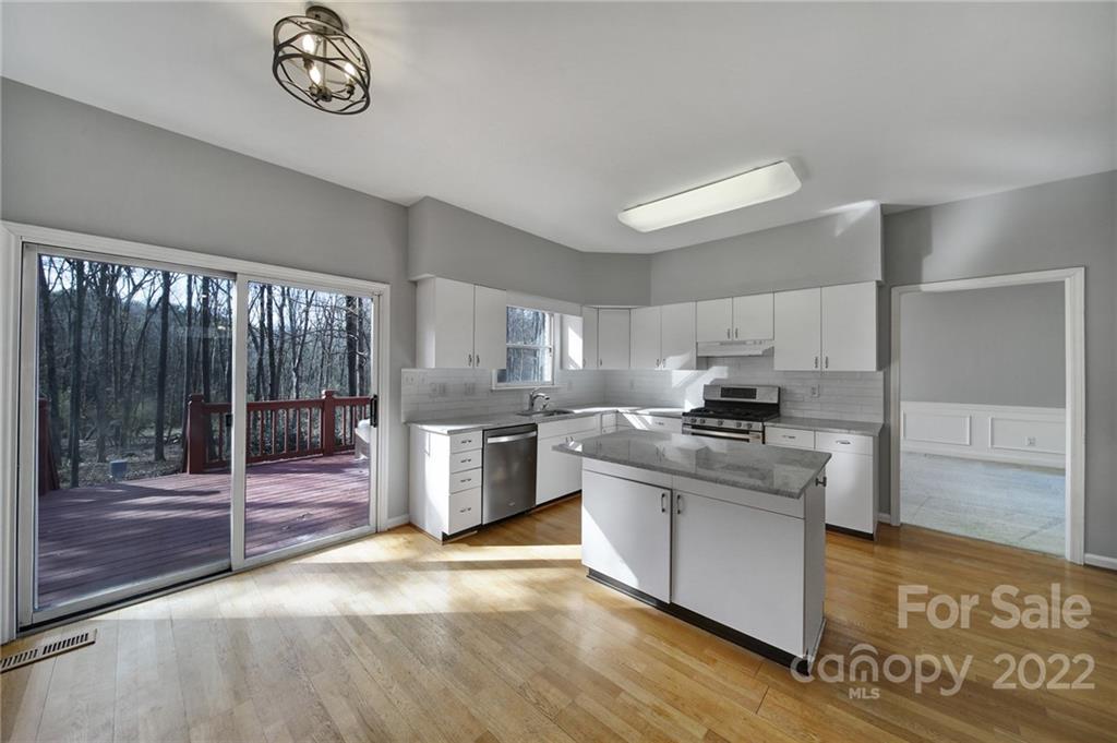 584 Cranborne Chase Fort Mill, SC 29708 - Photo 4 of 36 a kitchen with stainless steel appliances granite countertop a stove a sink and a refrigerator