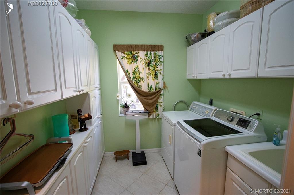 1946 Northwest Fork Road Stuart, FL 34994 - Photo 31 of 32 a room with a washer and dryer