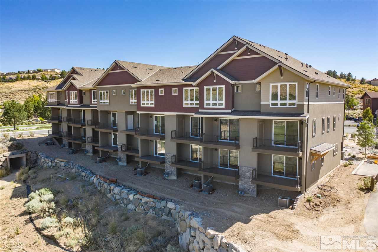 7730 Town Square Way, Unit 7 Reno, NV 89523 - Photo 1 of 9 a front view of a house with a yard