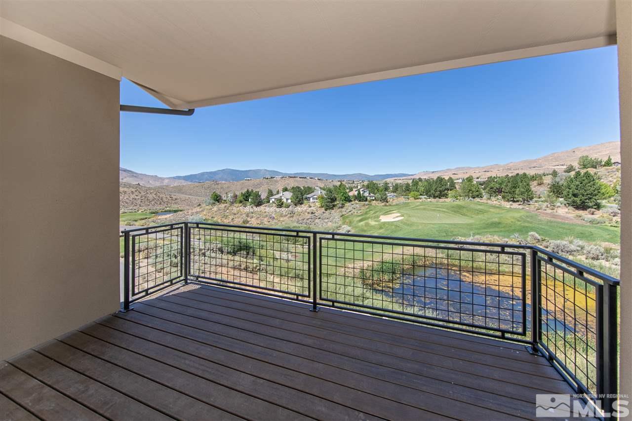 7730 Town Square Way, Unit 7 Reno, NV 89523 - Photo 3 of 9 a view of balcony with wooden floor & fence