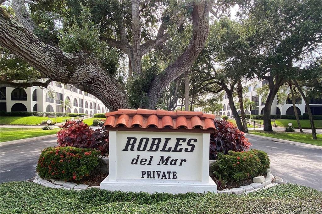 a view of outdoor space with sign board and garden