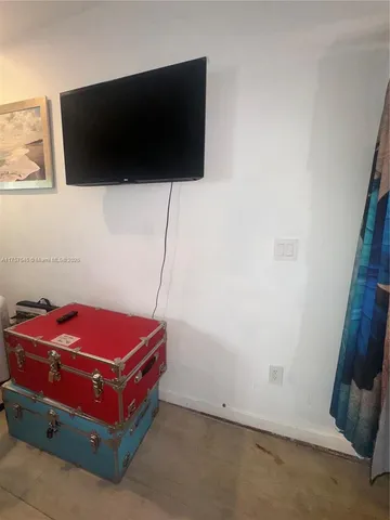 a room with furniture and flat screen tv