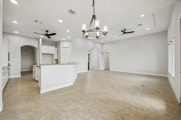 a view of a kitchen with a sink and stainless steel appliances