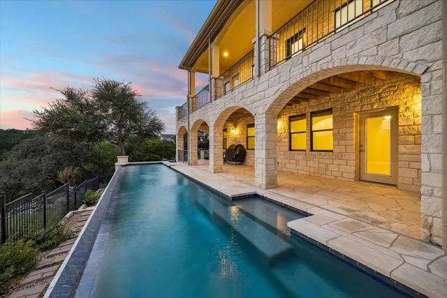 a view of a brick house with many windows