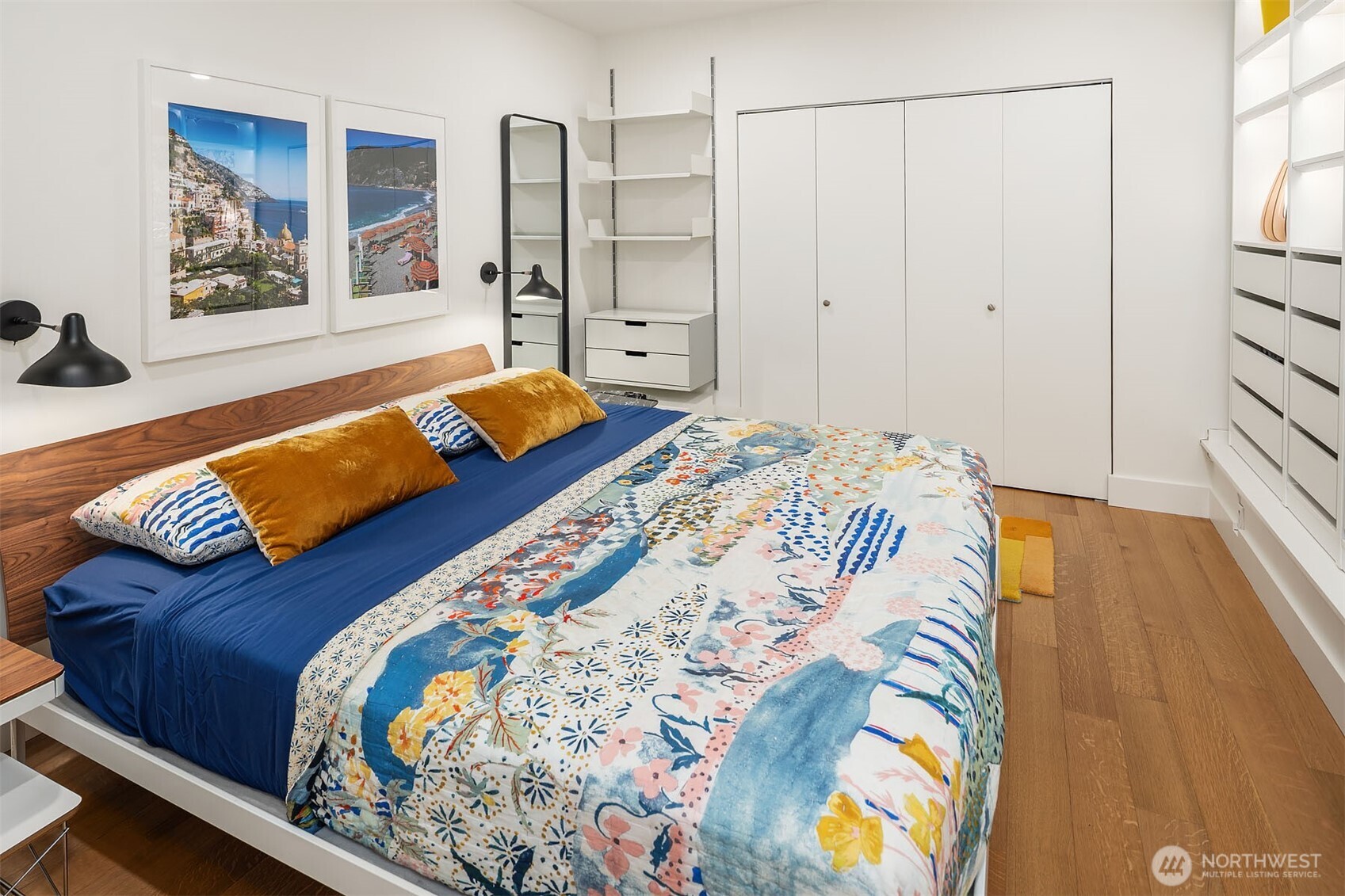 107 23rd Avenue, Unit A Seattle, WA 98122 - Photo 12 of 29 a bedroom with a bed and a painting on the wall