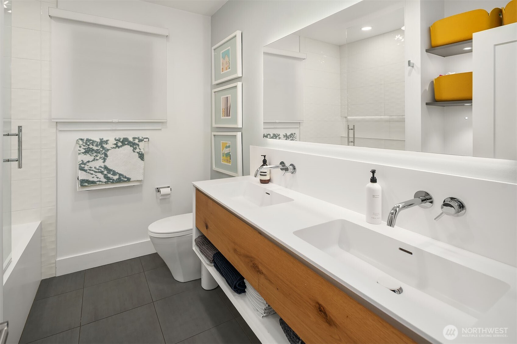 107 23rd Avenue, Unit A Seattle, WA 98122 - Photo 15 of 29 a bathroom with a sink and a mirror