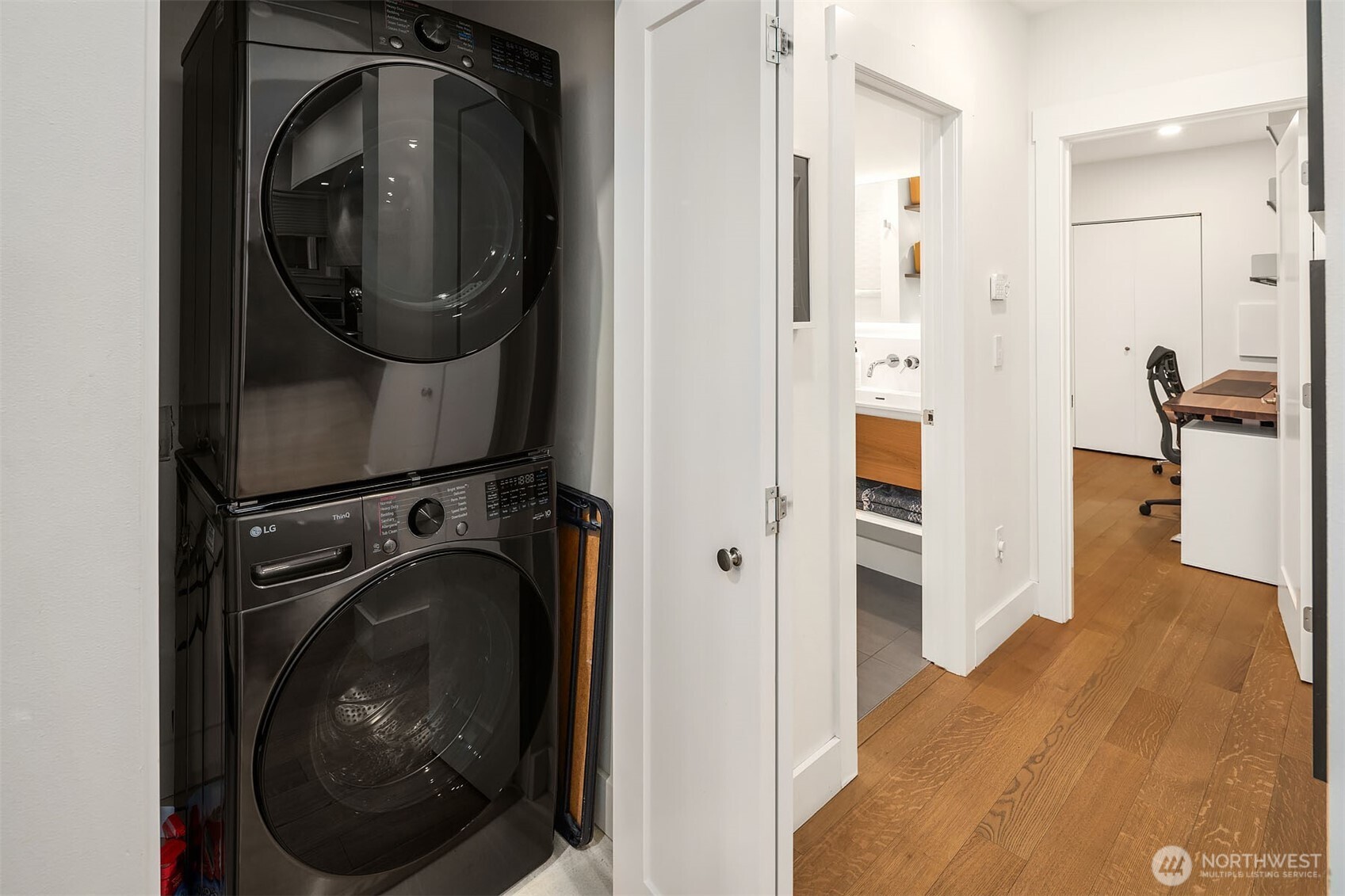 107 23rd Avenue, Unit A Seattle, WA 98122 - Photo 17 of 29 a view of a hallway with washer and dryer