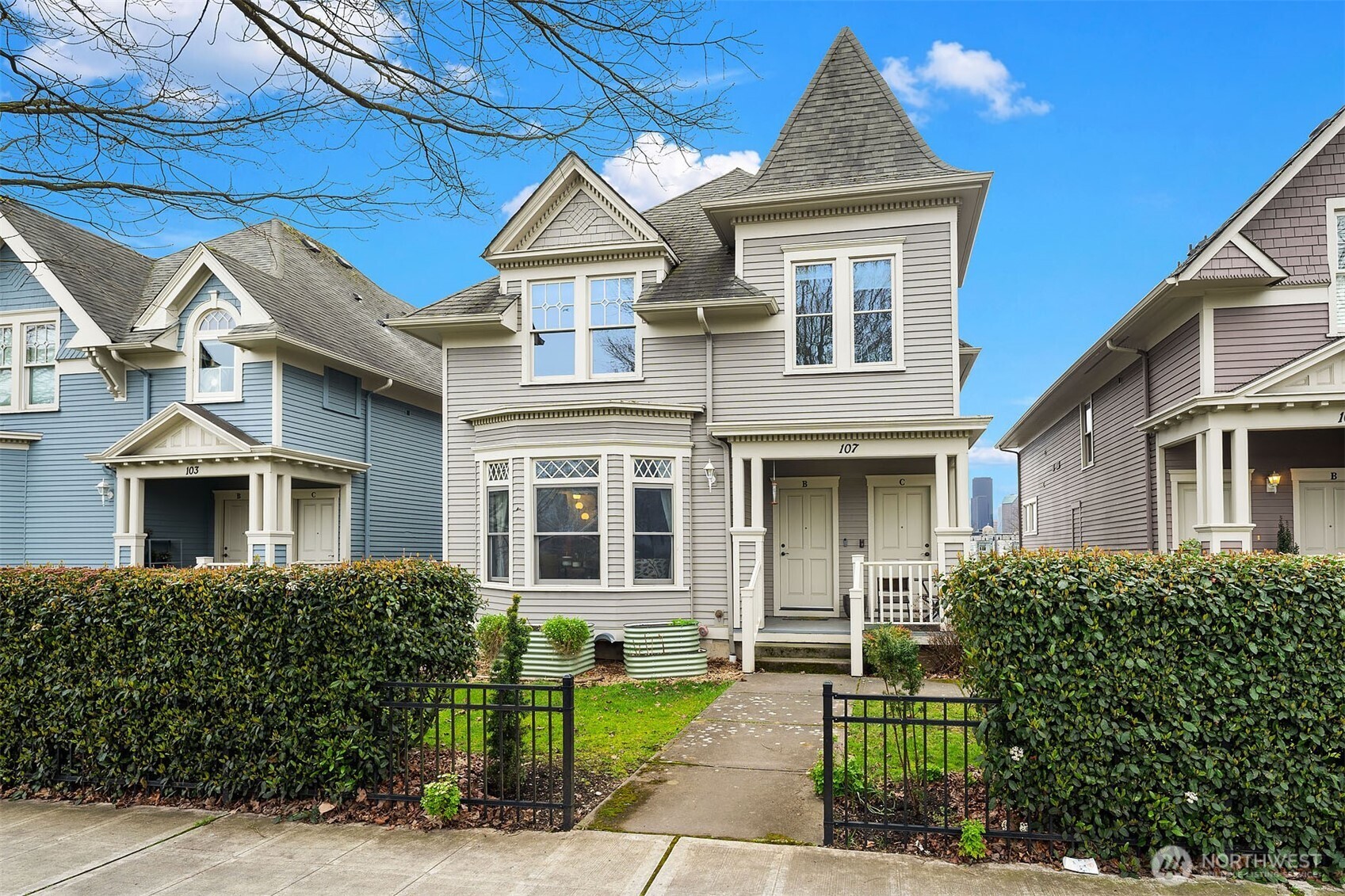 107 23rd Avenue, Unit A Seattle, WA 98122 - Photo 20 of 29 a front view of a house with a yard