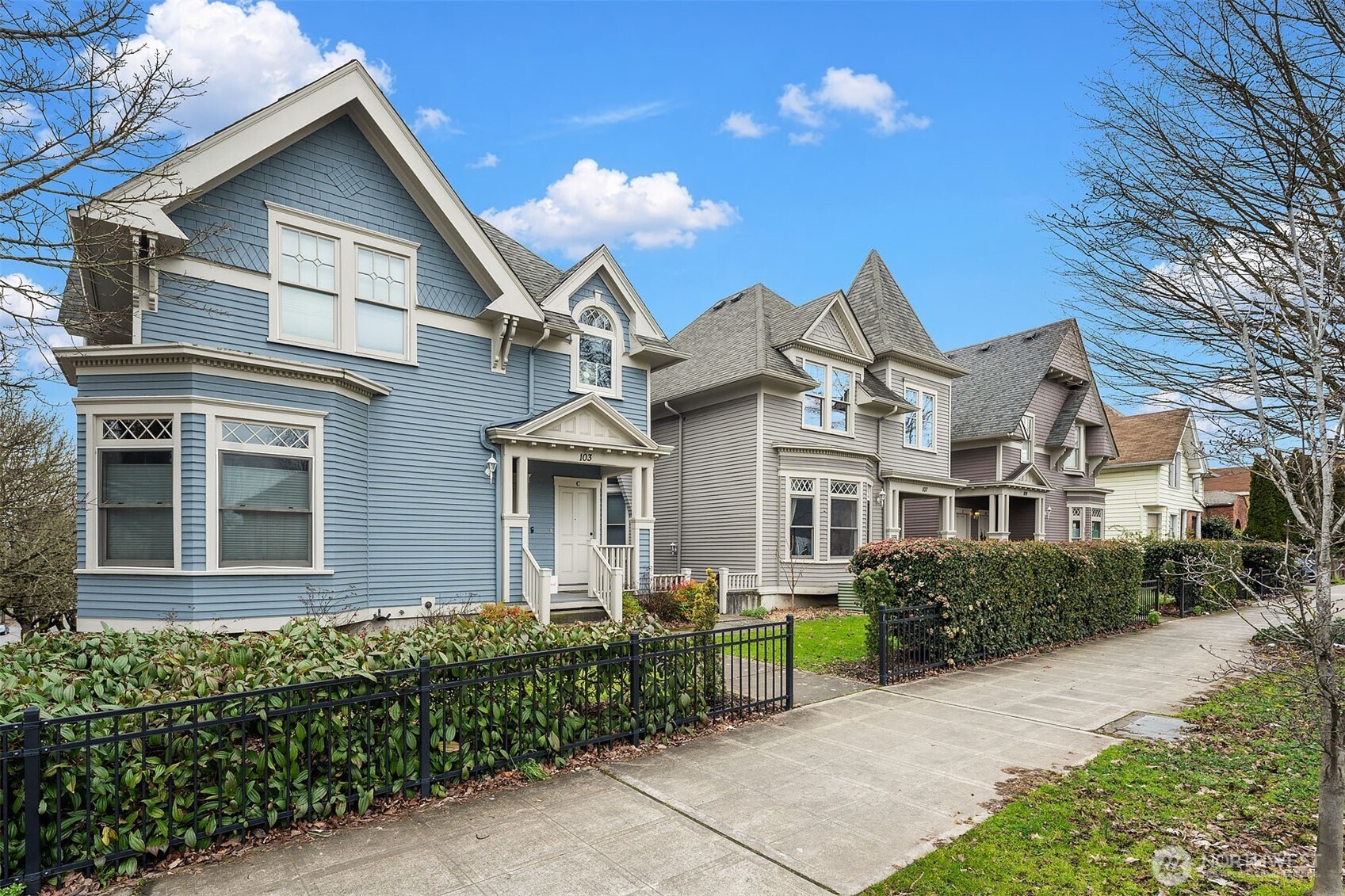 107 23rd Avenue, Unit A Seattle, WA 98122 - Photo 21 of 29 a front view of a house with a garden
