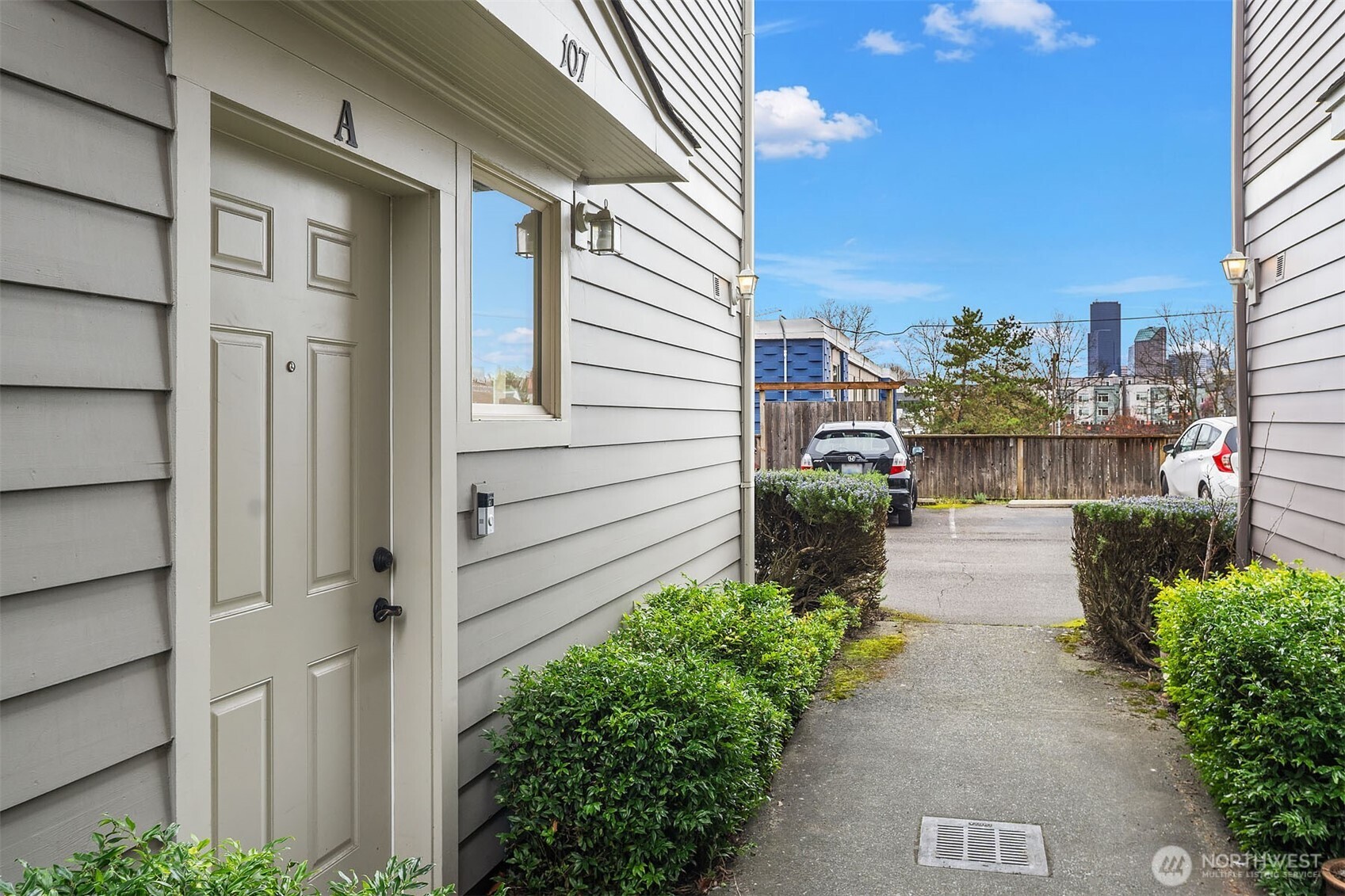107 23rd Avenue, Unit A Seattle, WA 98122 - Photo 29 of 29 a front view of a house with a garden