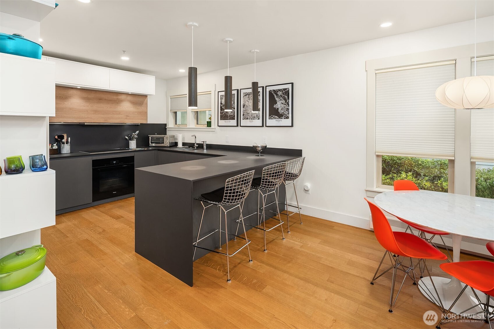 107 23rd Avenue, Unit A Seattle, WA 98122 - Photo 6 of 29 a kitchen with stainless steel appliances granite countertop a stove a sink and a microwave