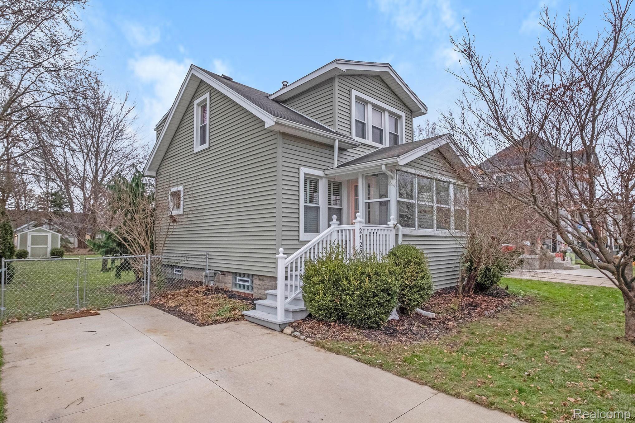 2125 Dorothea Road Berkley, MI 48072 - Photo 1 of 24 Side angle of Berkley bungalow with double driveway, bright staircase leading to side turn entrance