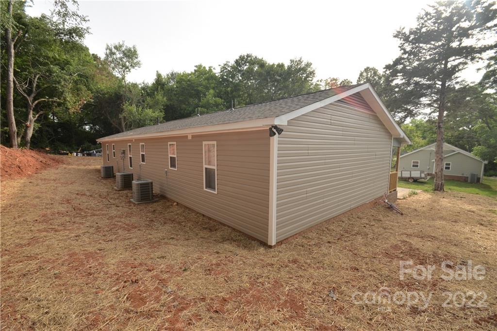 1701 Springdale Road Lancaster, SC 29720 - Photo 2 of 8 a view of a house with a backyard