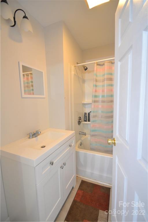 1701 Springdale Road Lancaster, SC 29720 - Photo 4 of 8 a bathroom with a sink a granite counter tops and a shower