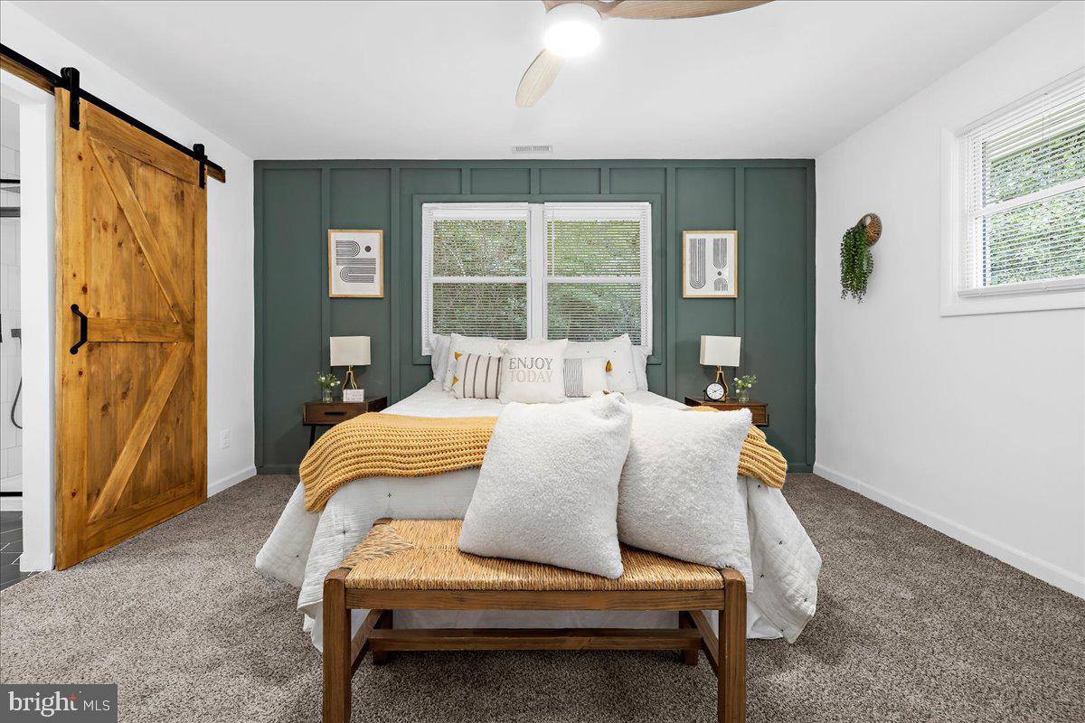 624 Sutton Drive Pasadena, MD 21122 - Photo 16 of 64 a bedroom with a bed and window