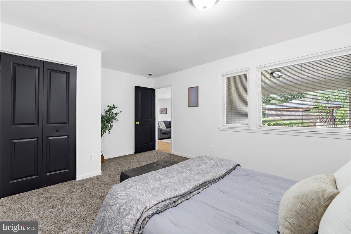 624 Sutton Drive Pasadena, MD 21122 - Photo 23 of 64 a bedroom with a bed and a window