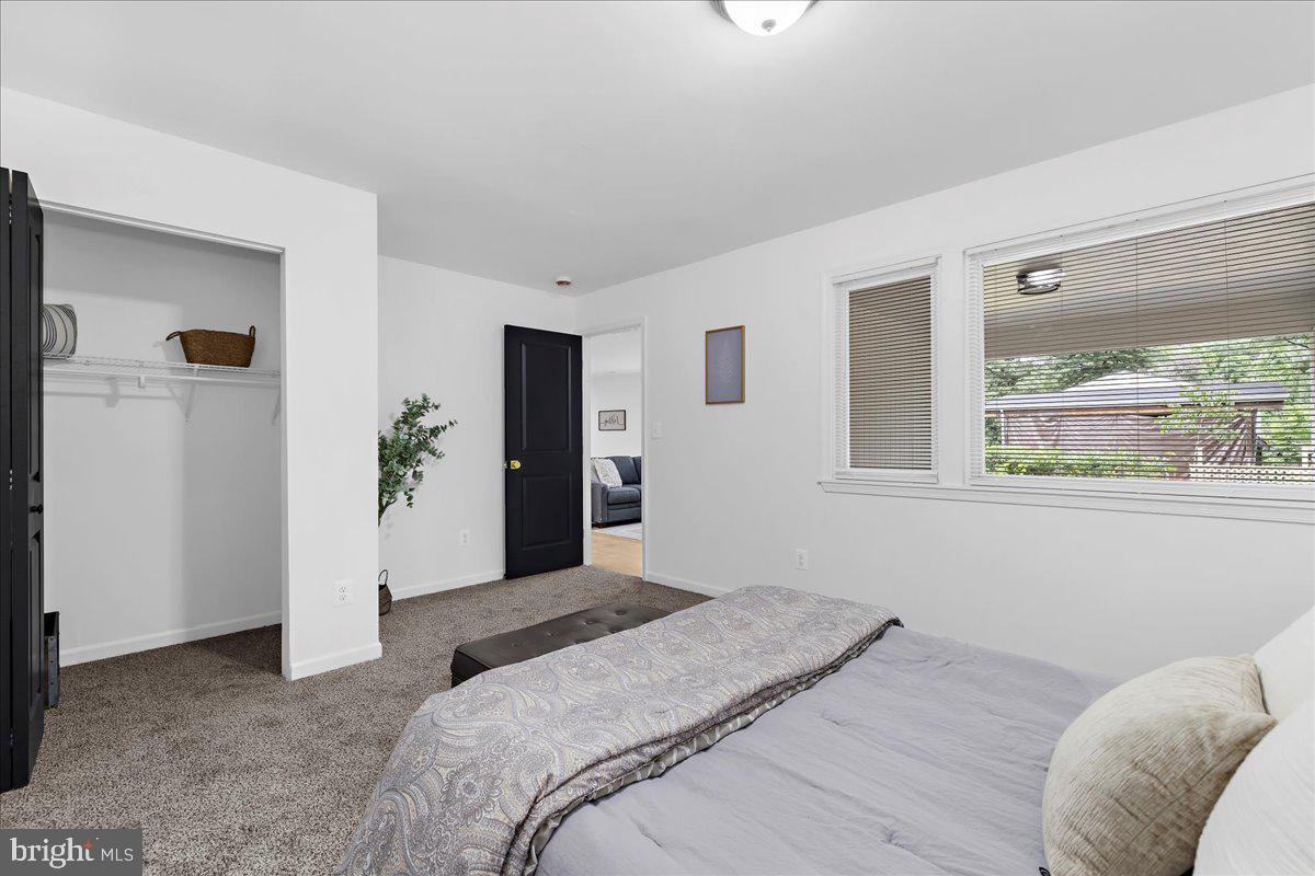 624 Sutton Drive Pasadena, MD 21122 - Photo 24 of 64 a bedroom with a bed and a window