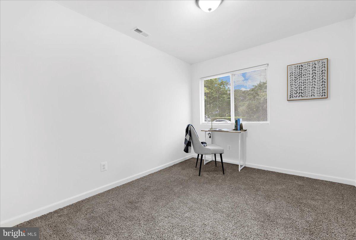 624 Sutton Drive Pasadena, MD 21122 - Photo 27 of 64 a living room with furniture and a window