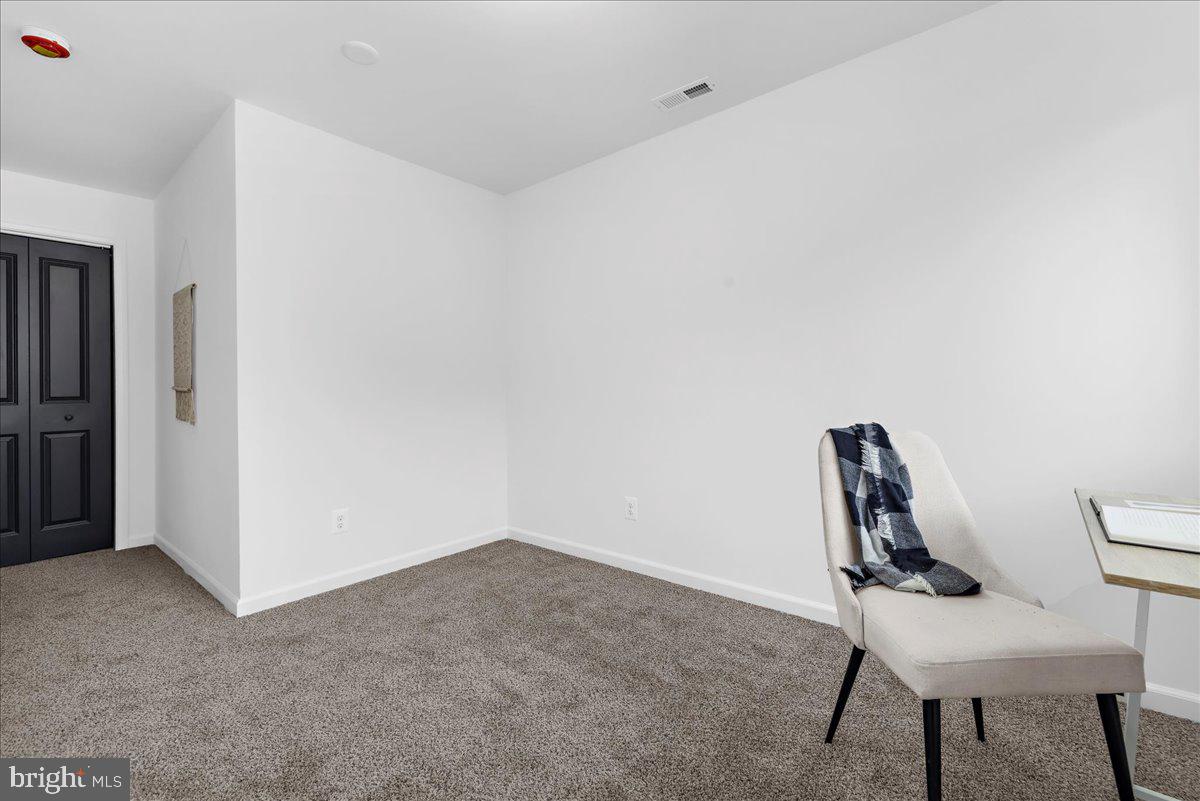 624 Sutton Drive Pasadena, MD 21122 - Photo 28 of 64 a view of workspace with chair and wooden floor