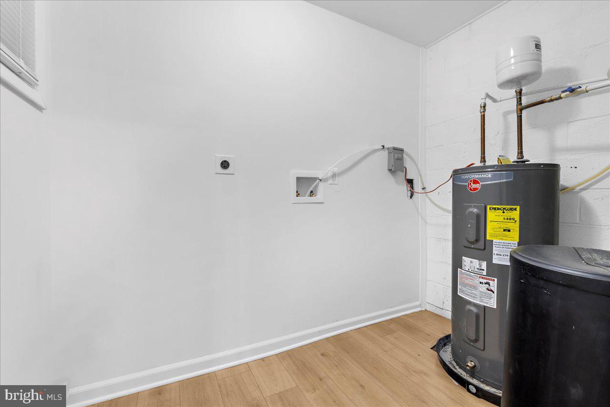 624 Sutton Drive Pasadena, MD 21122 - Photo 31 of 64 a view of room with wooden floor