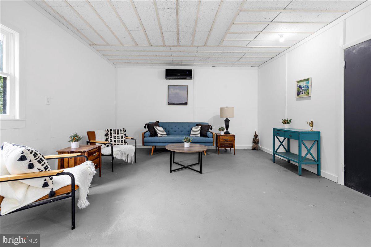 624 Sutton Drive Pasadena, MD 21122 - Photo 33 of 64 a living room with furniture and a couch