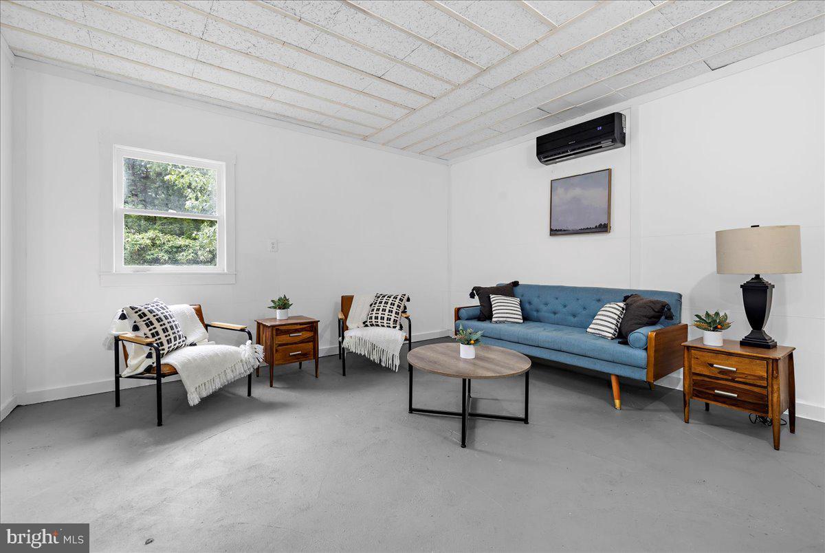 624 Sutton Drive Pasadena, MD 21122 - Photo 35 of 64 a living room with furniture and a window