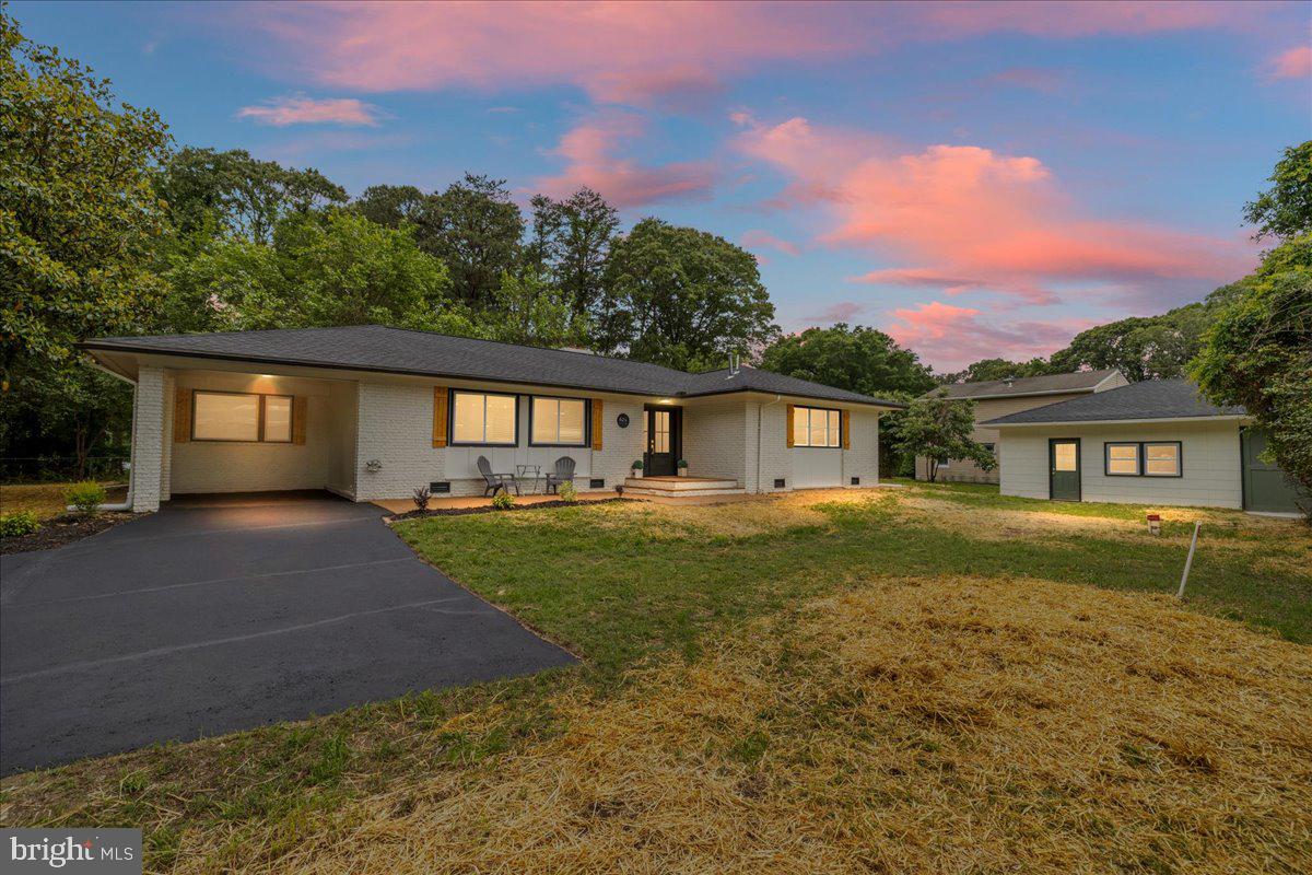 624 Sutton Drive Pasadena, MD 21122 - Photo 42 of 64 a front view of a house with a yard