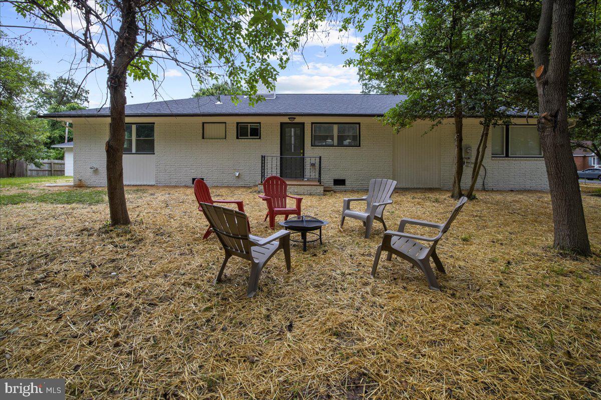 624 Sutton Drive Pasadena, MD 21122 - Photo 47 of 64 a view of a house with backyard and sitting area