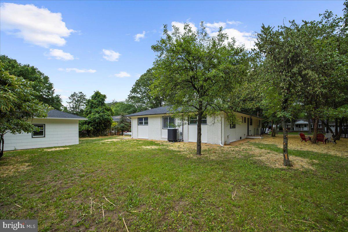 624 Sutton Drive Pasadena, MD 21122 - Photo 51 of 64 a house with a tree in front of it