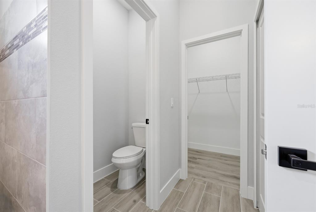 4487 Southwest 152nd Street Ocala, FL 34473 - Photo 23 of 41 a bathroom with a toilet and a sink