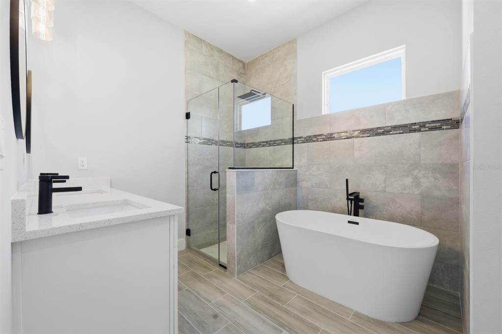 4487 Southwest 152nd Street Ocala, FL 34473 - Photo 24 of 41 a bathroom with a sink and a bathtub