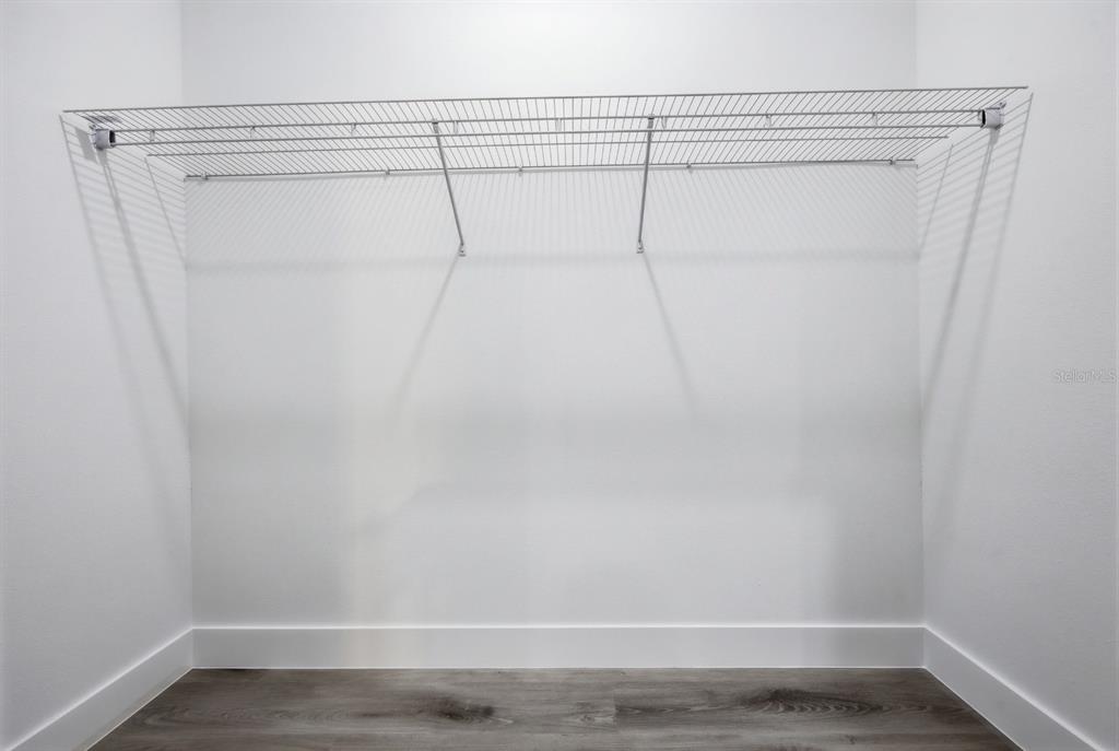 4487 Southwest 152nd Street Ocala, FL 34473 - Photo 27 of 41 a view of a room with racks on the wall