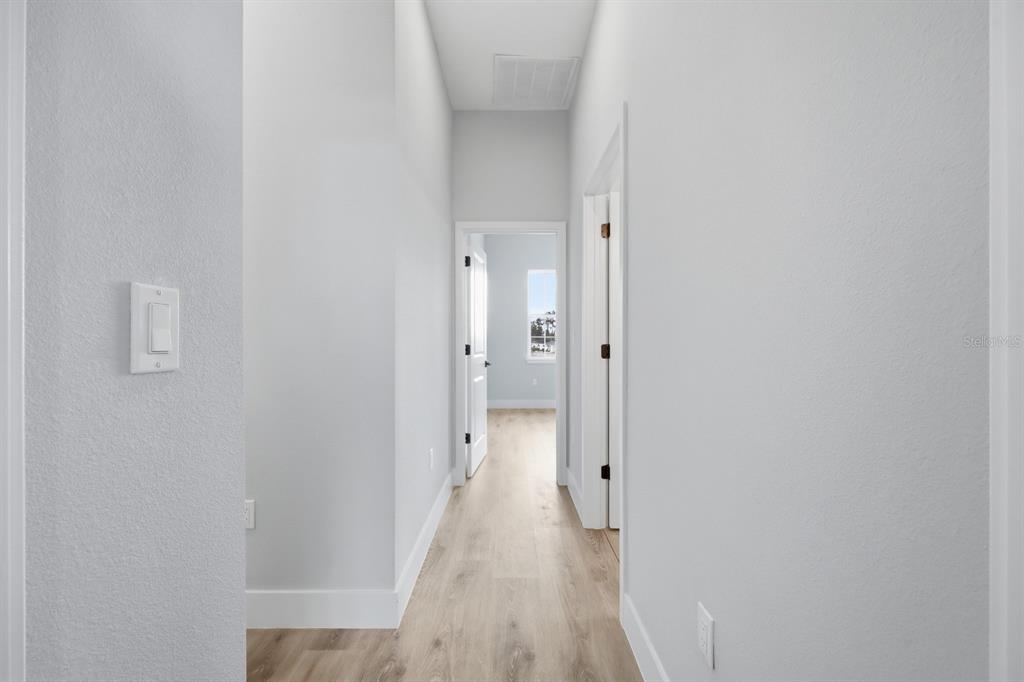 4487 Southwest 152nd Street Ocala, FL 34473 - Photo 30 of 41 a view of a hallway with wooden floor
