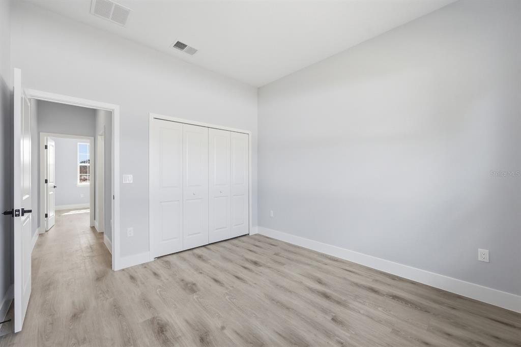 4487 Southwest 152nd Street Ocala, FL 34473 - Photo 31 of 41 wooden floor in an empty room