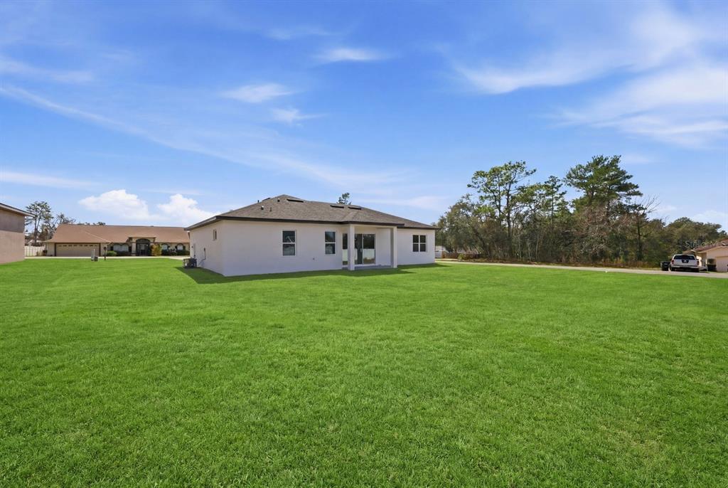 4487 Southwest 152nd Street Ocala, FL 34473 - Photo 7 of 41 a view of a house with a big yard