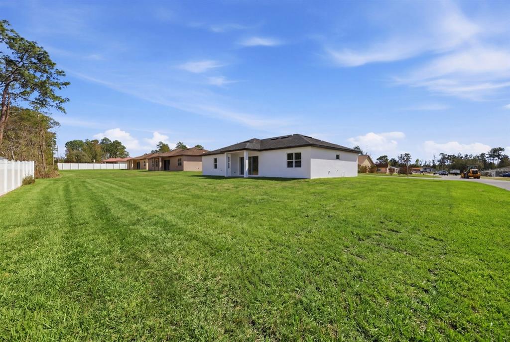 4487 Southwest 152nd Street Ocala, FL 34473 - Photo 9 of 41 a house view with a garden space