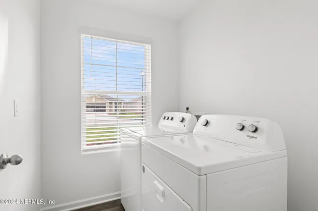 a utility room with dryer and washer