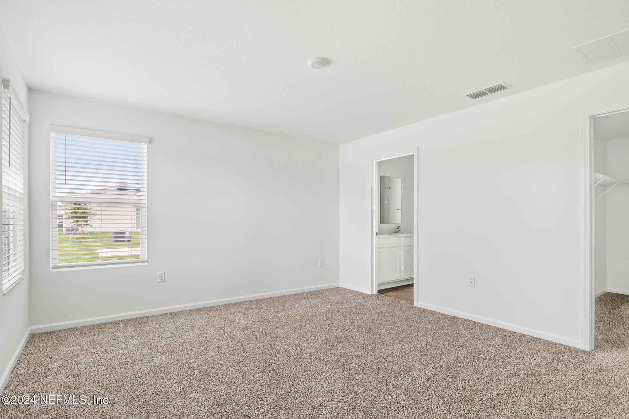 12470 Rubber Fig Terrace Jacksonville, FL 32218 - Photo 10 of 20 a view of an empty room with a window