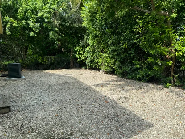 a view of backyard with green space