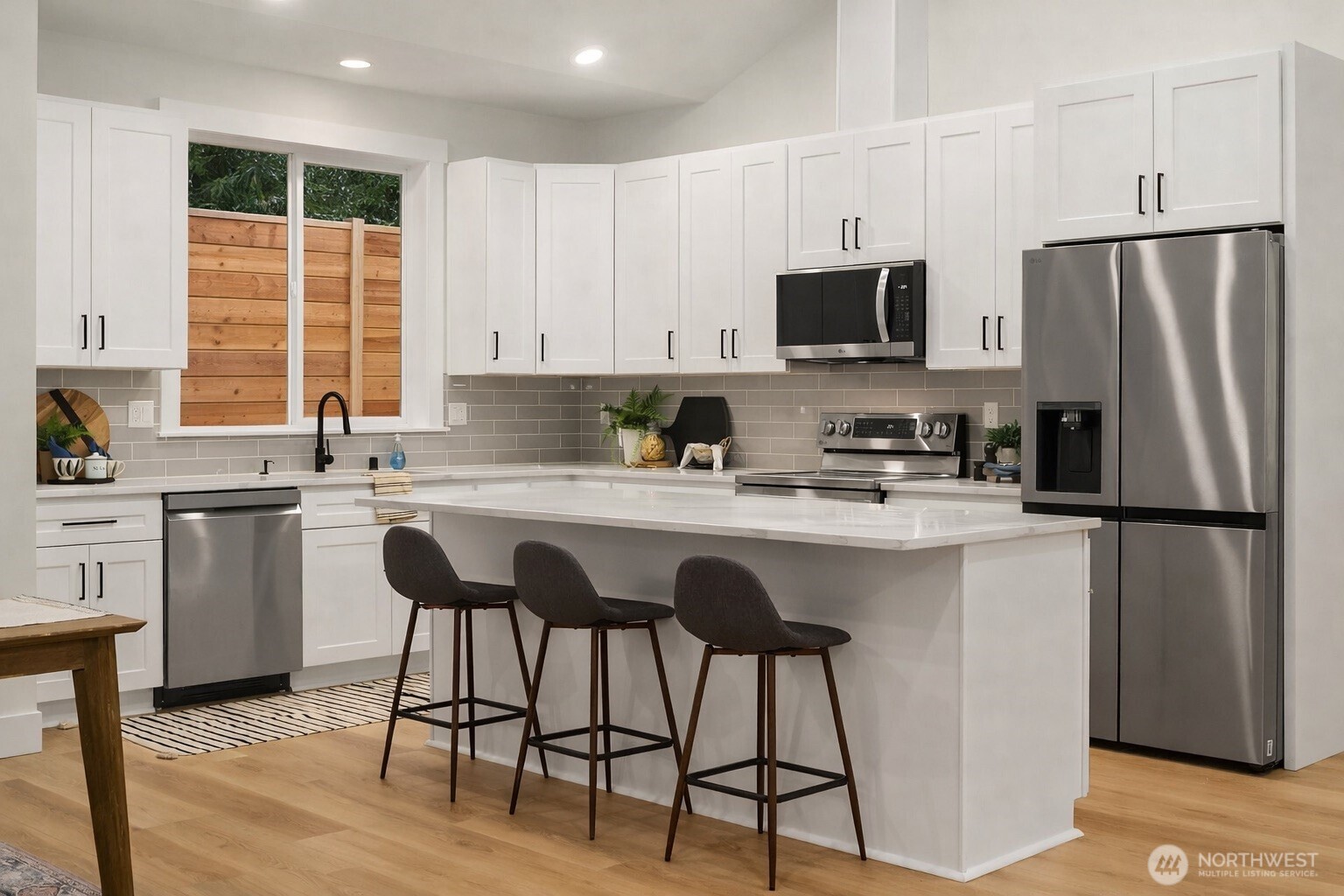 4 Twin Flower Circle Bellingham, WA 98229 - Photo 11 of 31 a kitchen with appliances a sink cabinets and a window