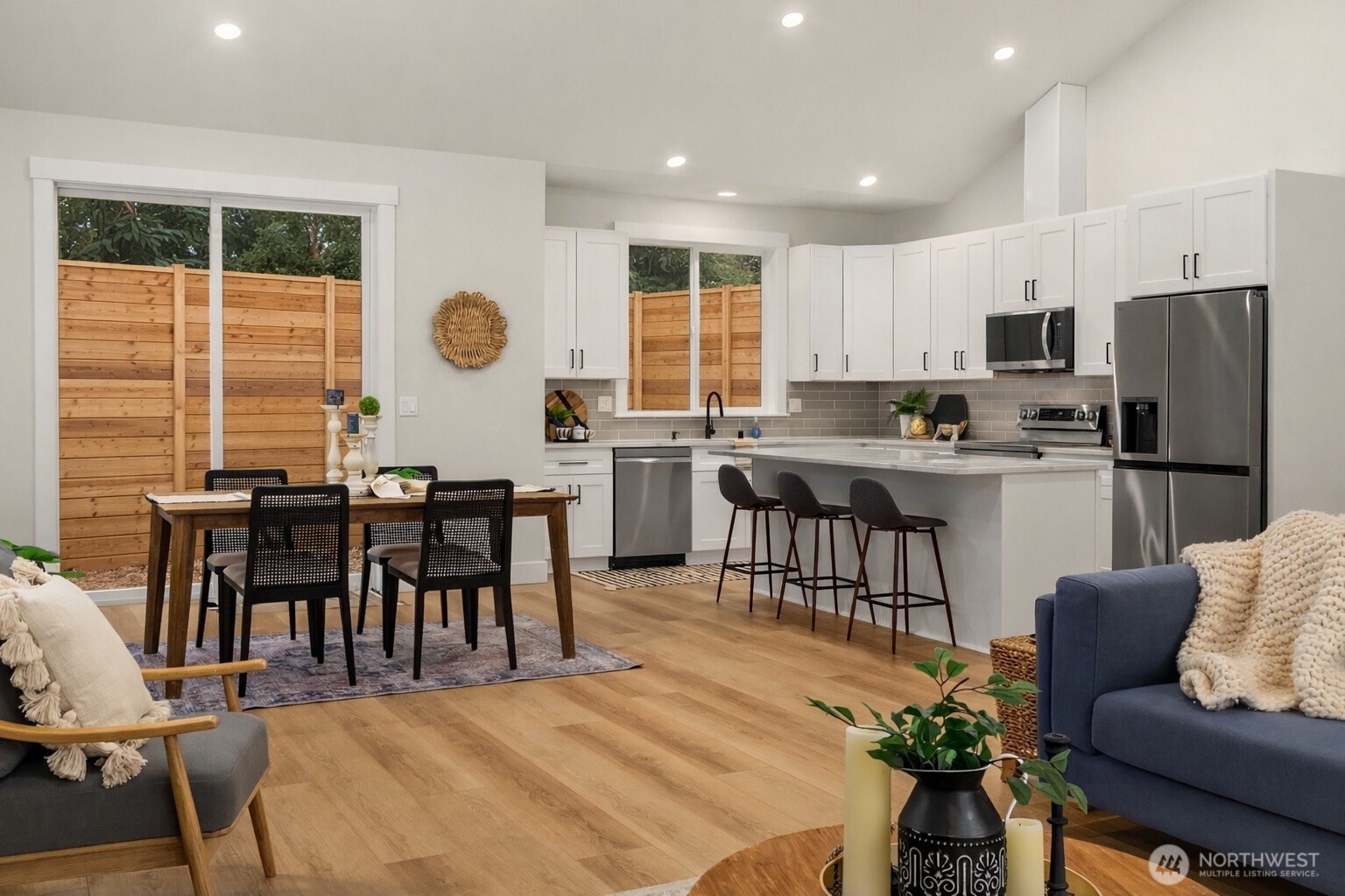 4 Twin Flower Circle Bellingham, WA 98229 - Photo 10 of 31 a kitchen with counter top dining table and stainless steel appliances